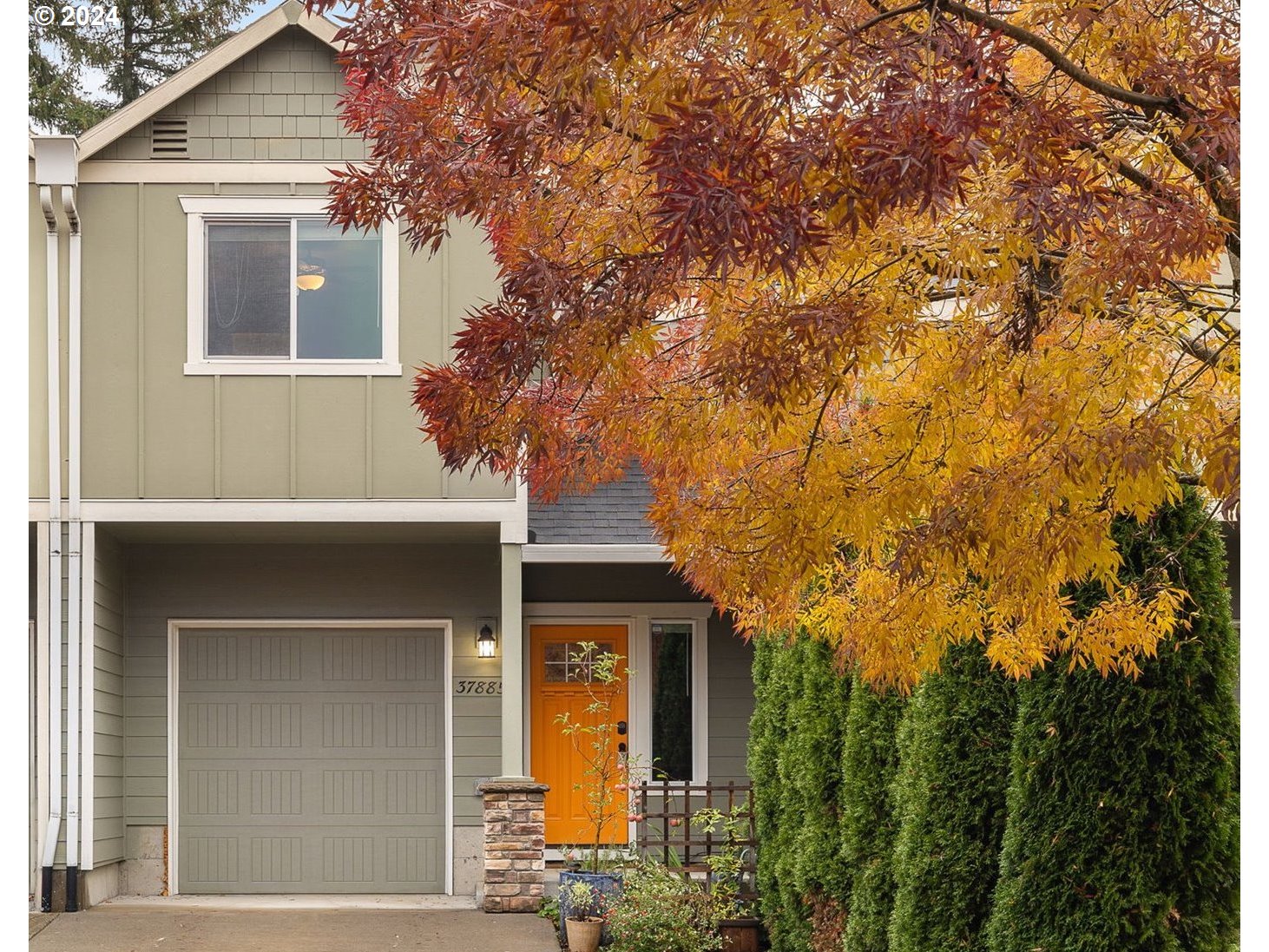 a front view of a house with garden