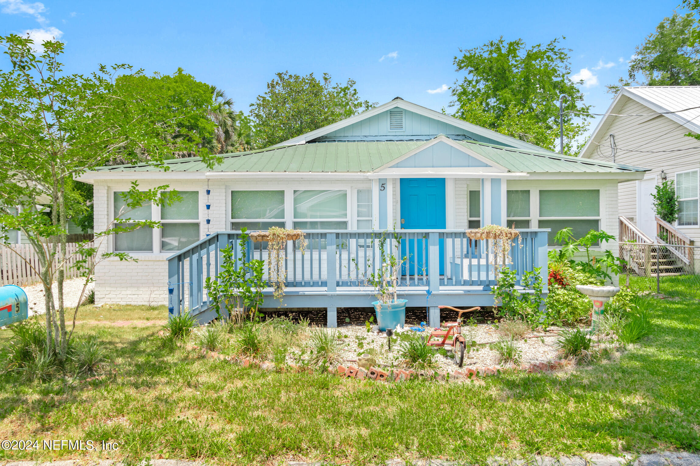 front view of a house with a small yard