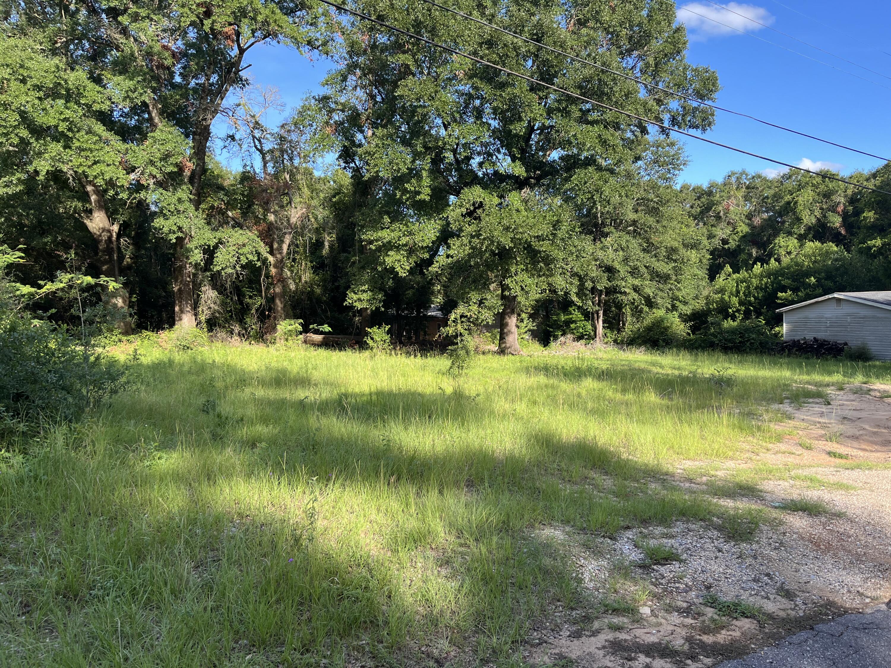 a view of a lake with a yard