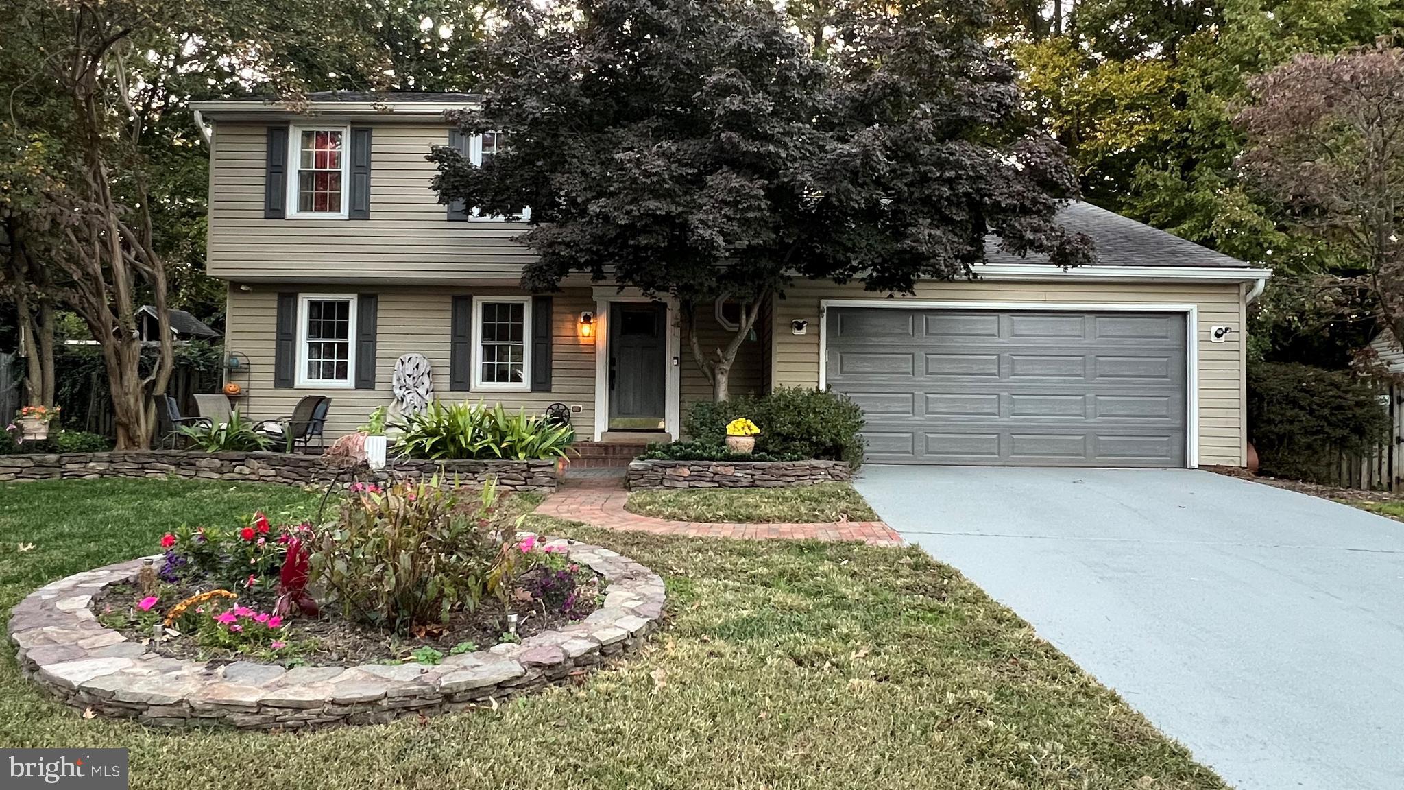 a front view of a house with a yard and porch