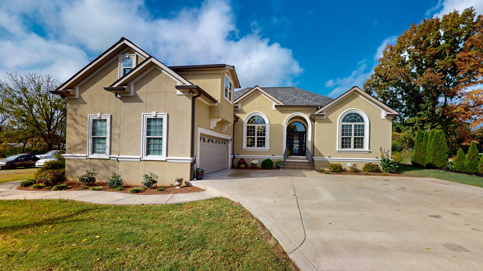 a front view of a house with a yard