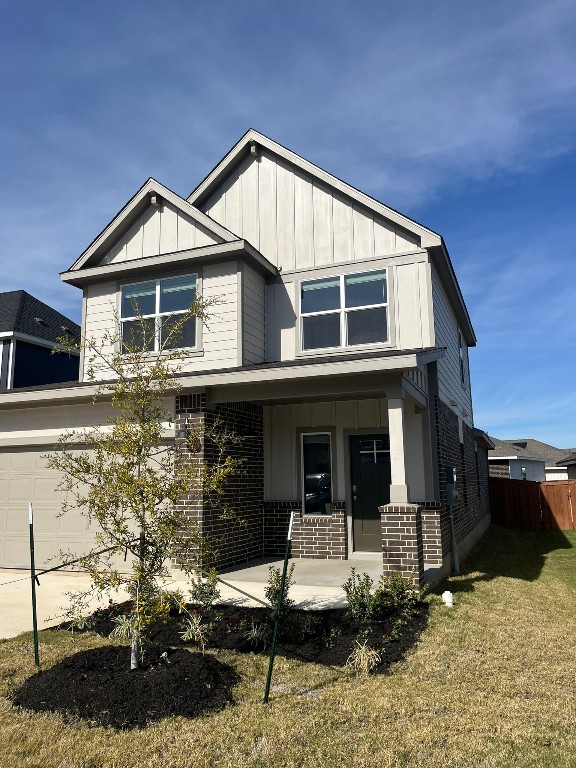 a front view of a house with yard