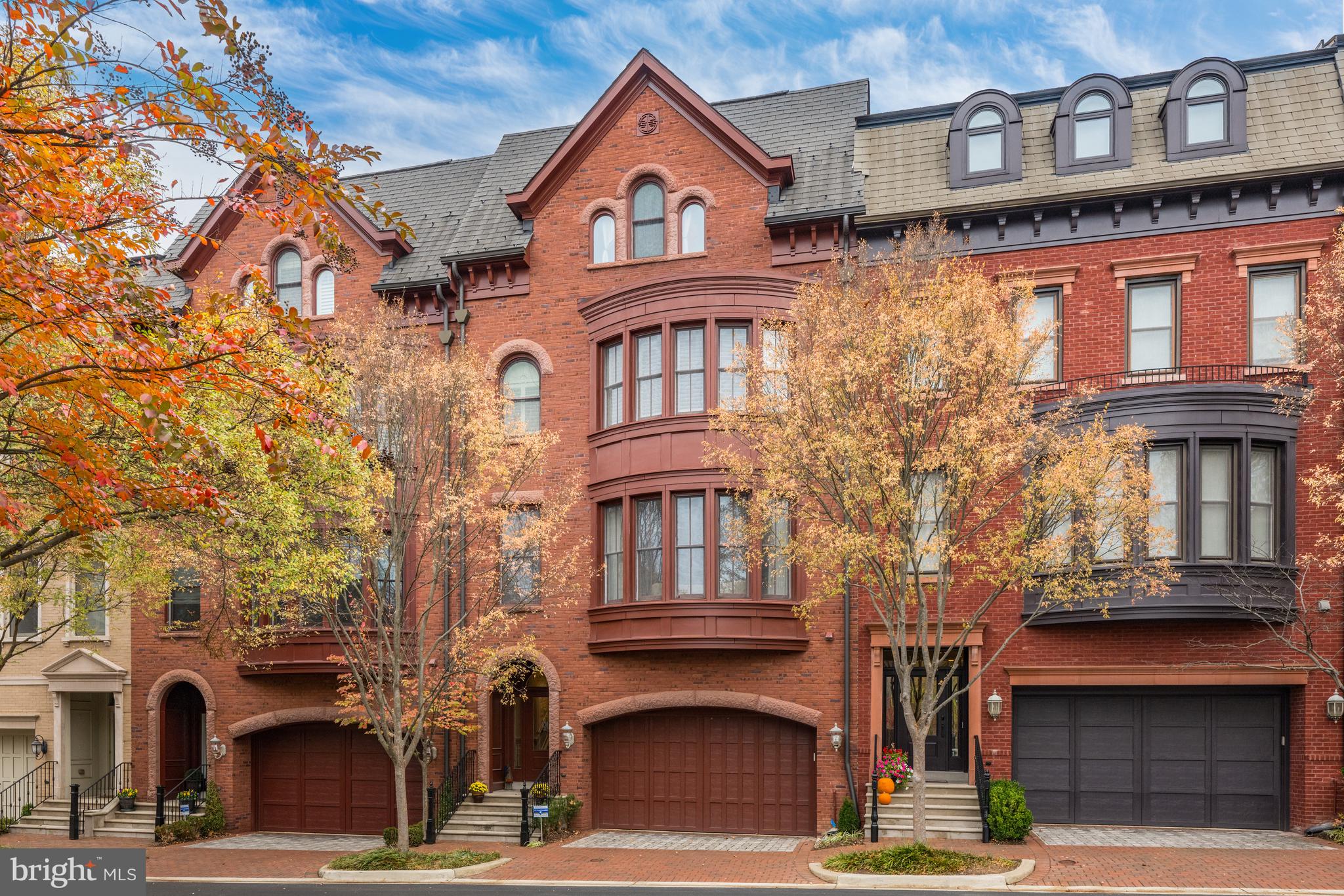 a front view of a residential apartment building with a yard