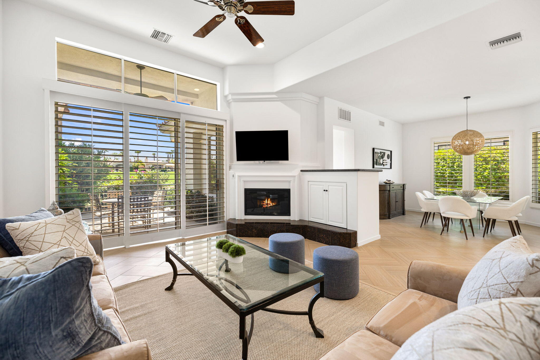 a living room with furniture fireplace and window