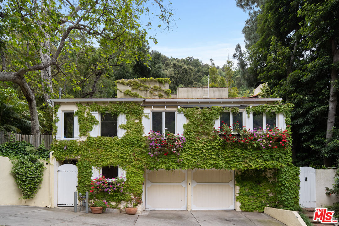 front view of a house with a garden