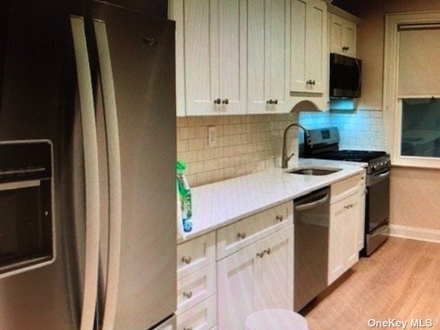 a view of a kitchen with appliances