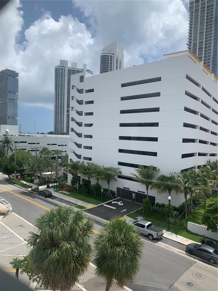 a view of a building with a yard