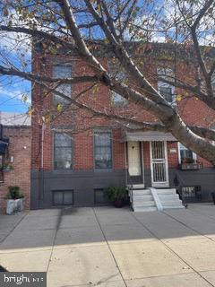 a front view of a house with parking area