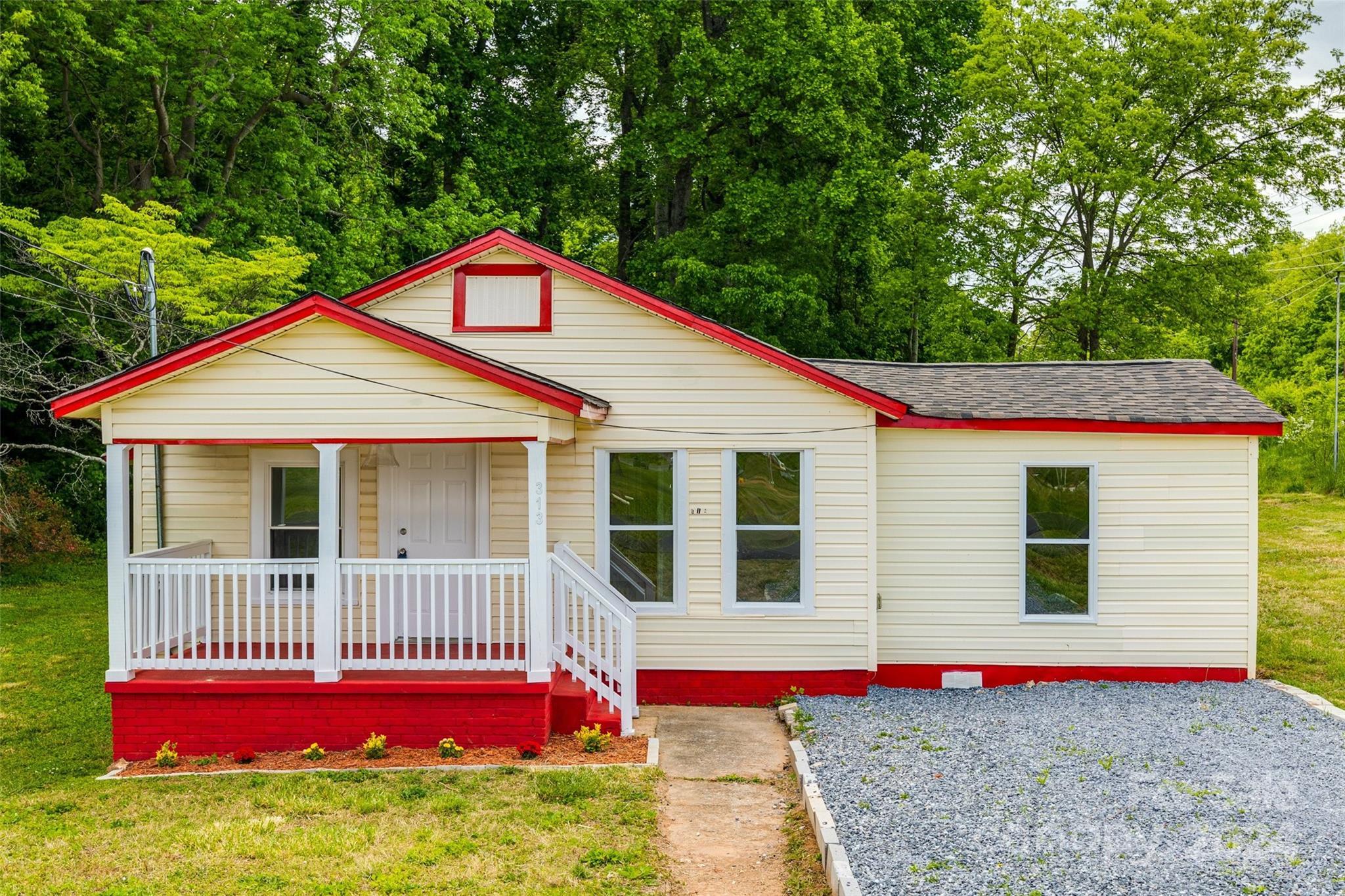 a view of a house with a yard