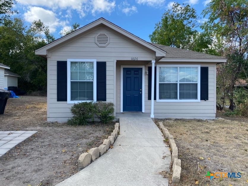 a front view of a house with garage