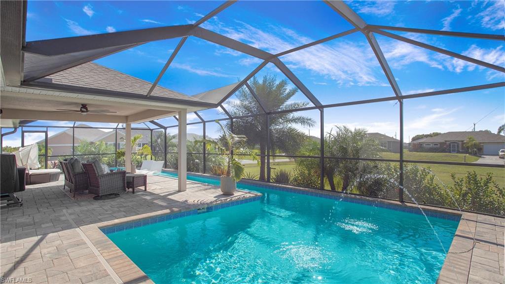 a view of a swimming pool with a patio