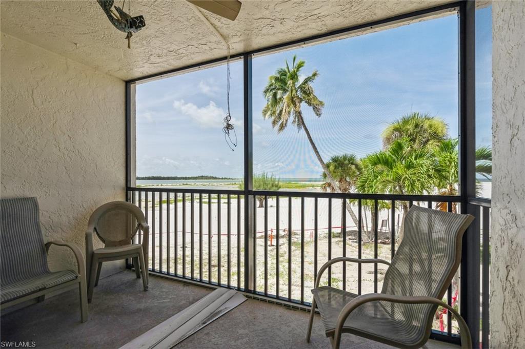 a view of a balcony with furniture