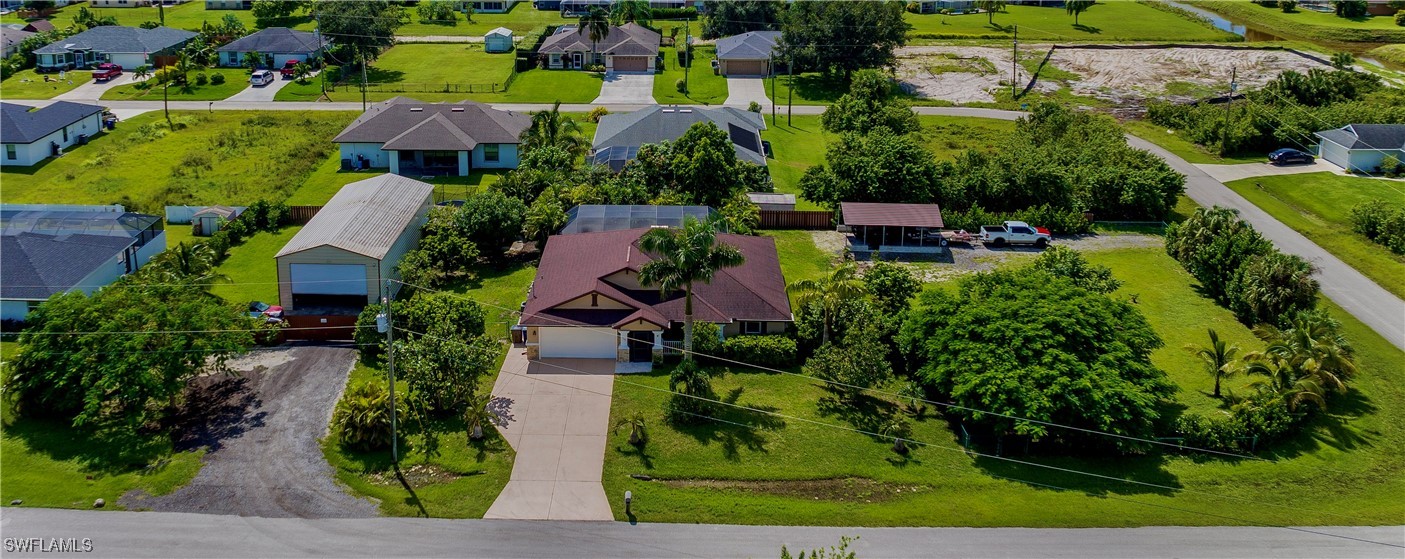 an aerial view of a house with a garden