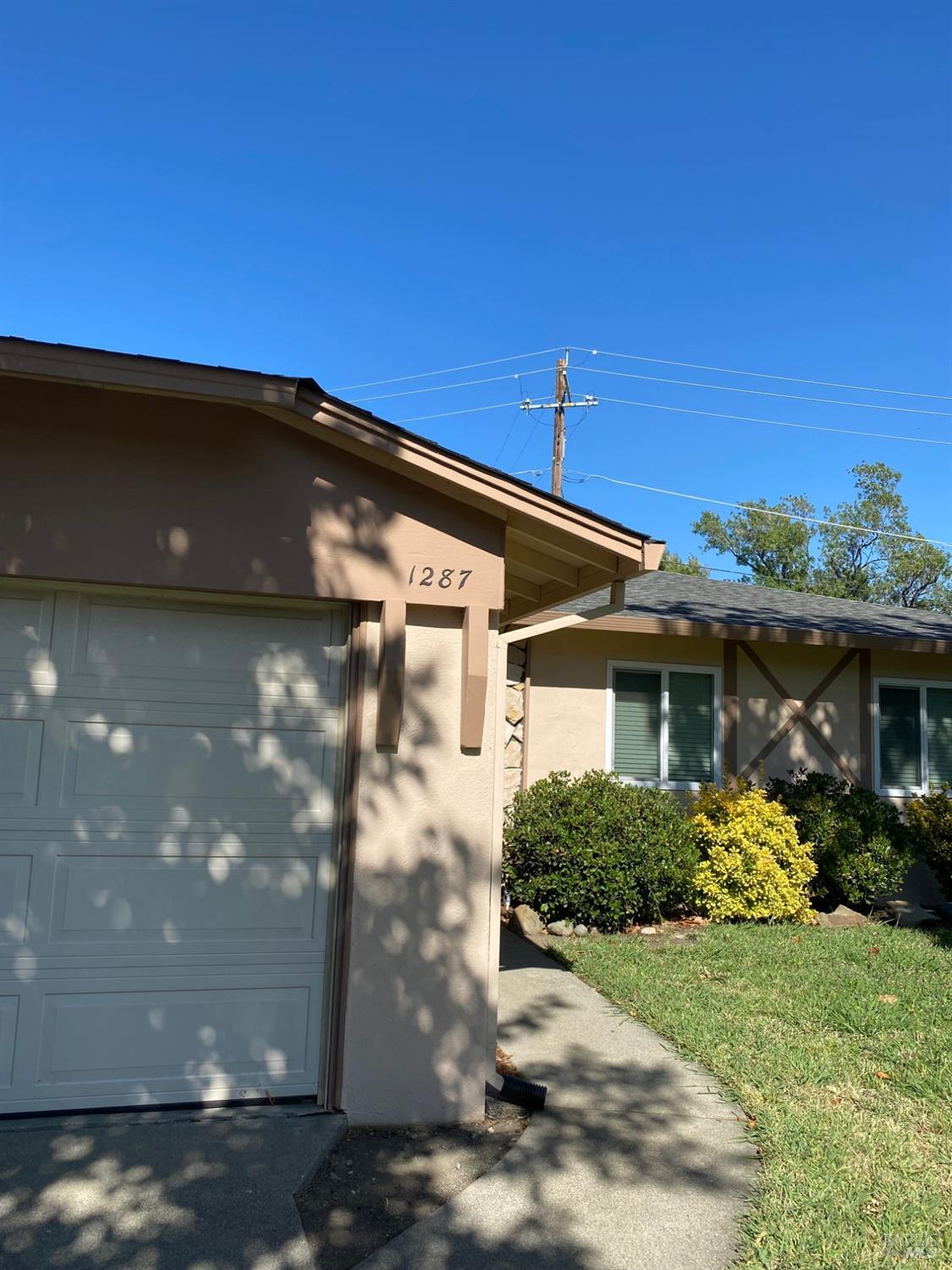 a view of house with yard