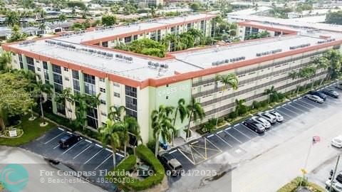 a picture of a building with a lot of flower plants