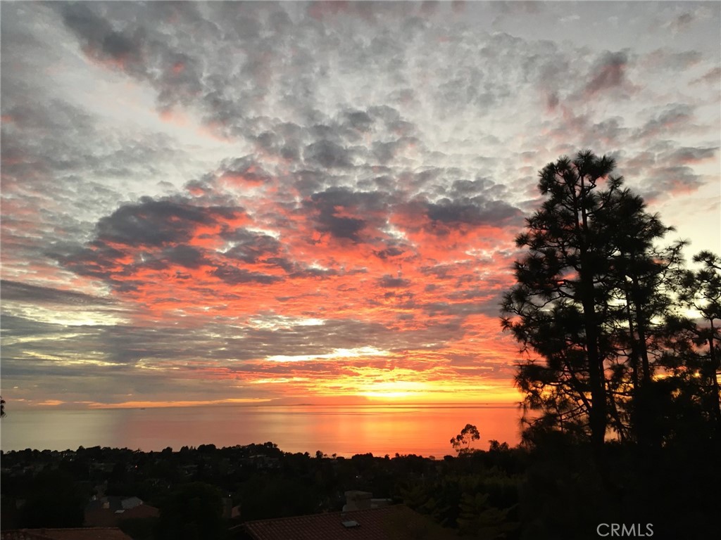 a view of sunset and city