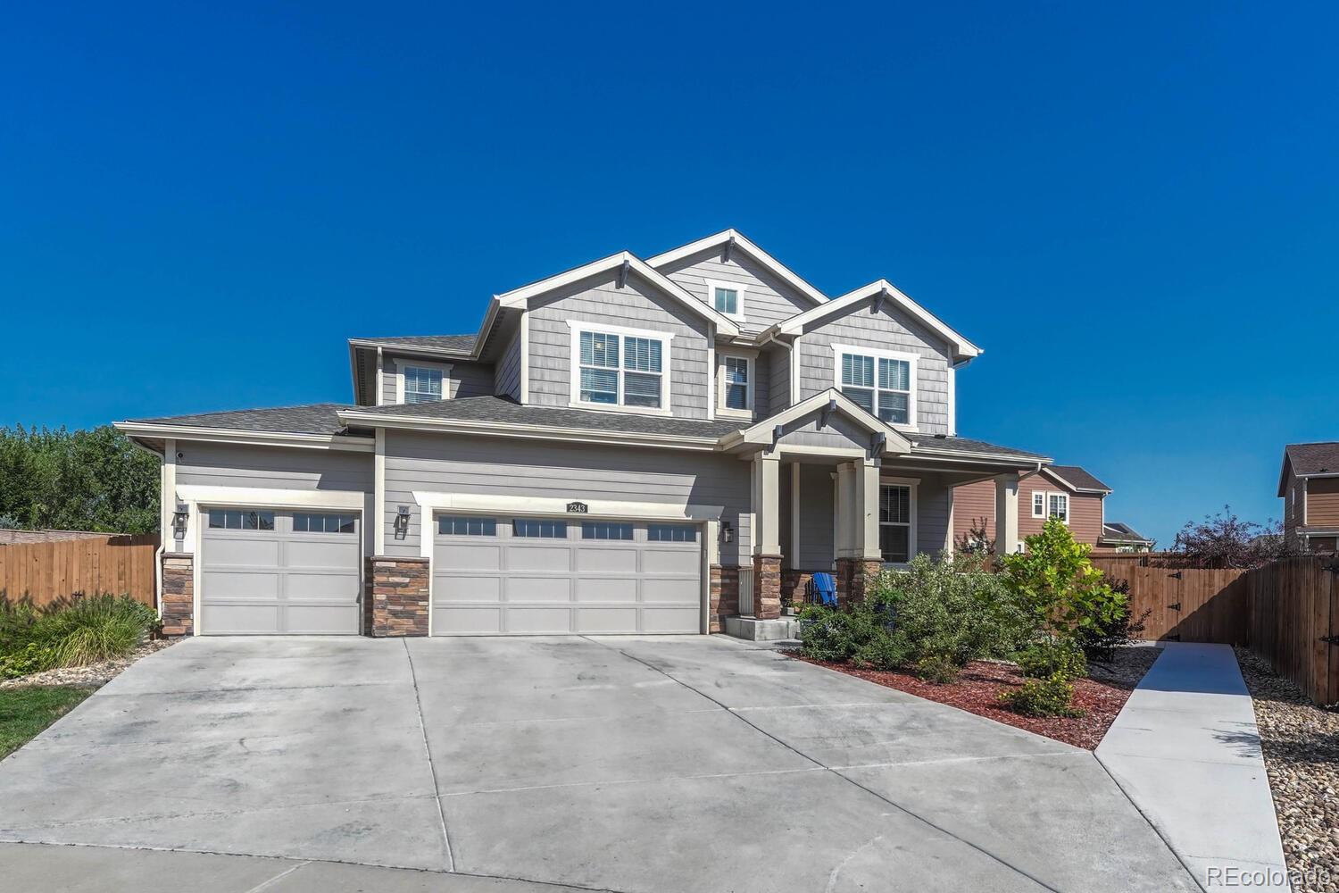 a front view of a house with a garage