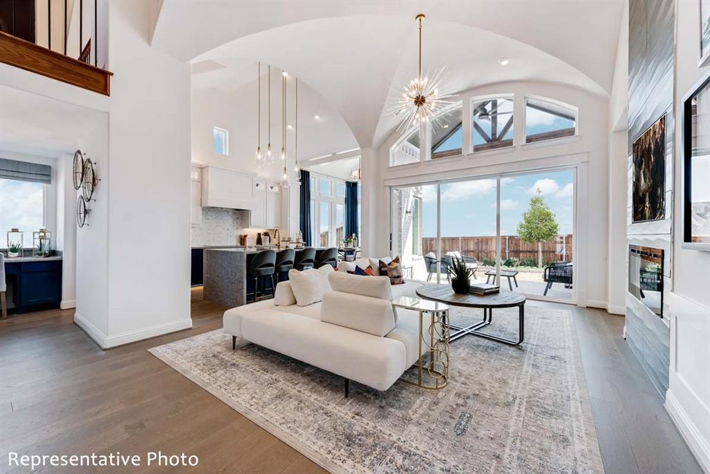 a living room with patio bathtub and a chandelier