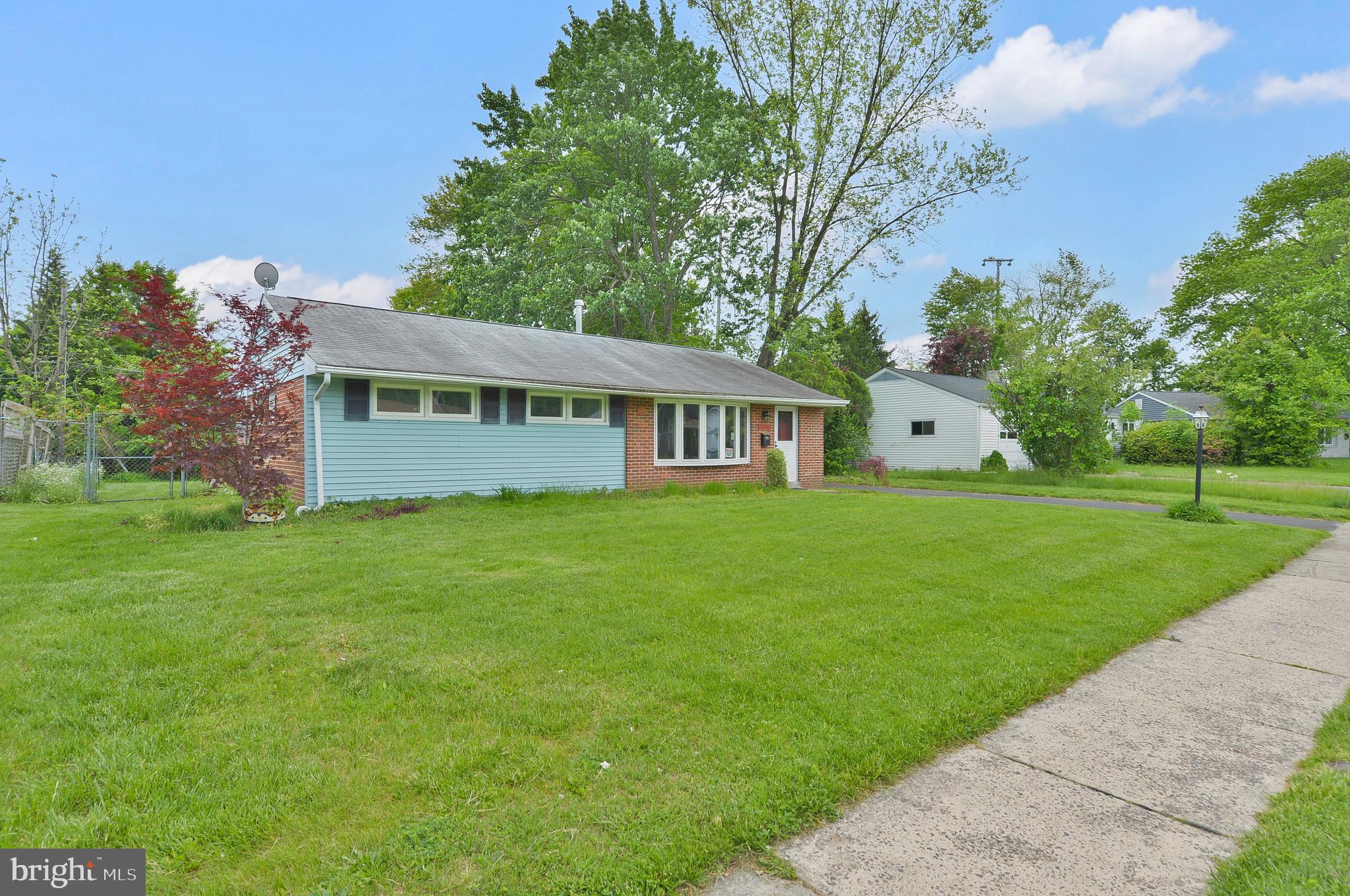 a view of an house with backyard space and garden