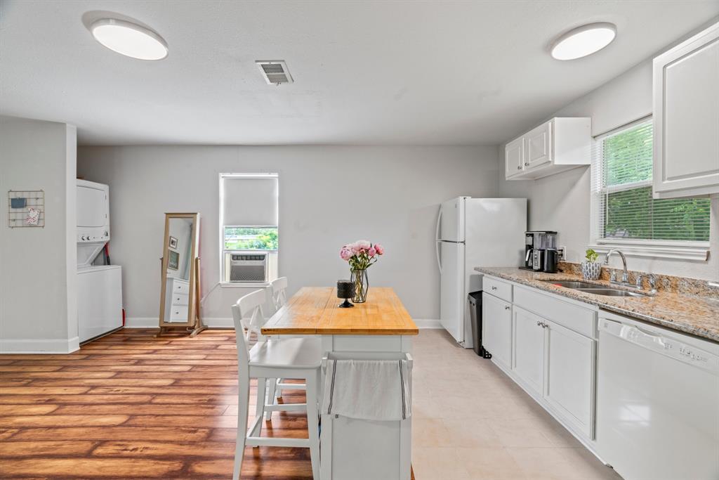 a kitchen with stainless steel appliances kitchen island sink refrigerator and stove