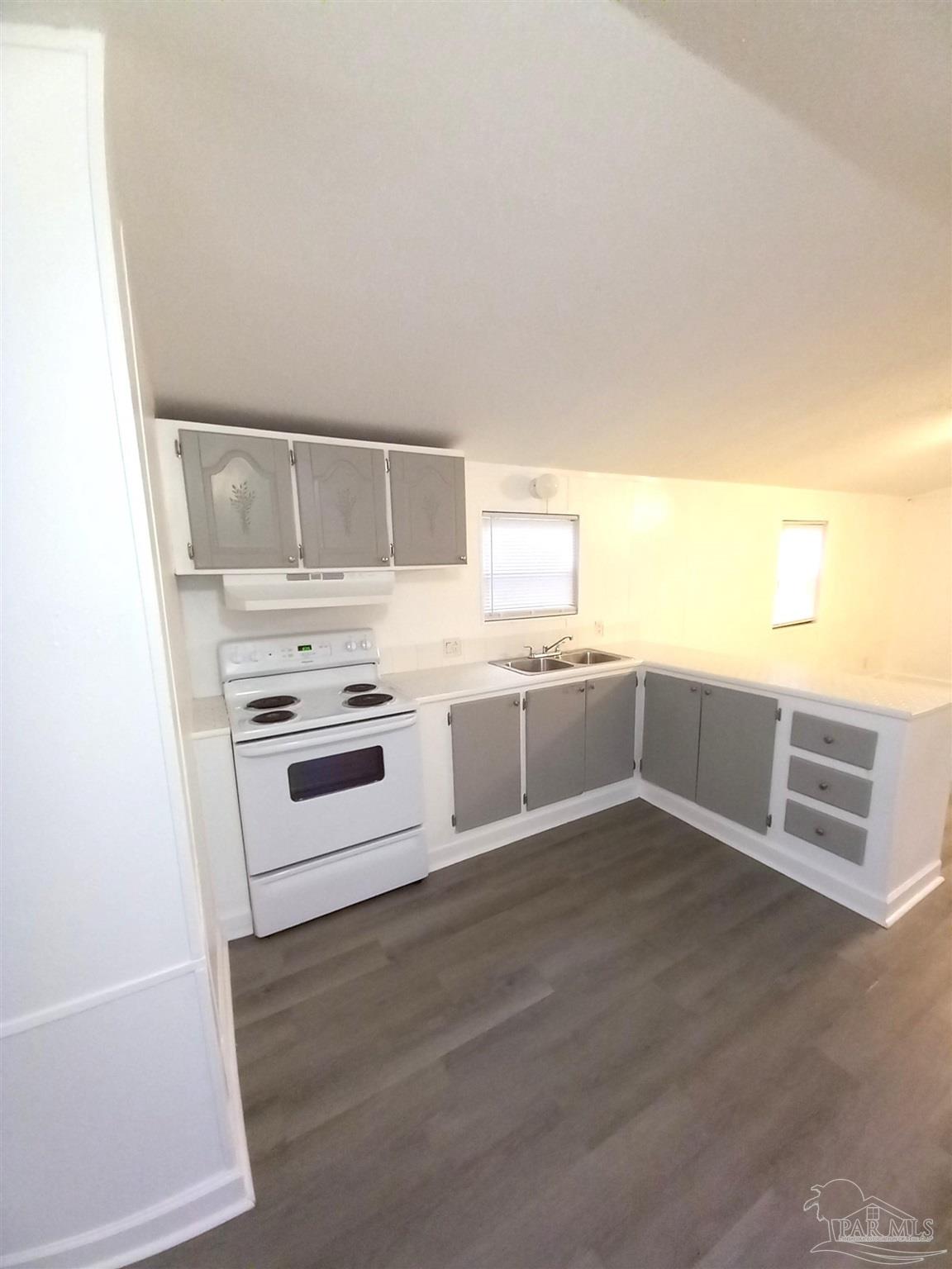 a view of cabinets and wooden floor