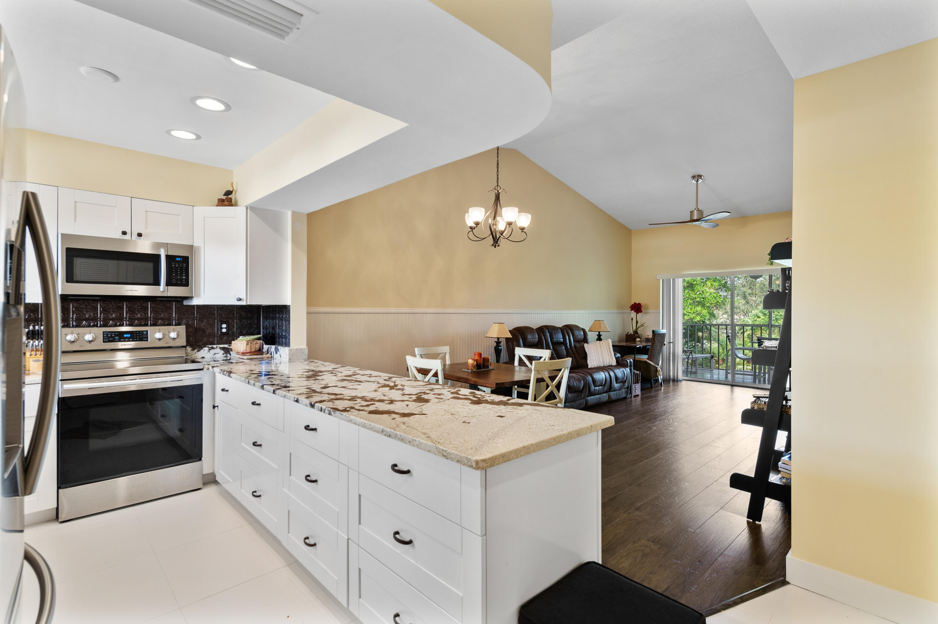 a kitchen with a sink appliances and cabinets