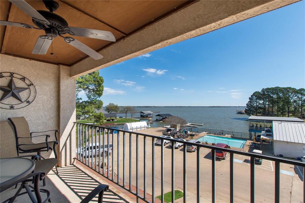 a view of a balcony with furniture