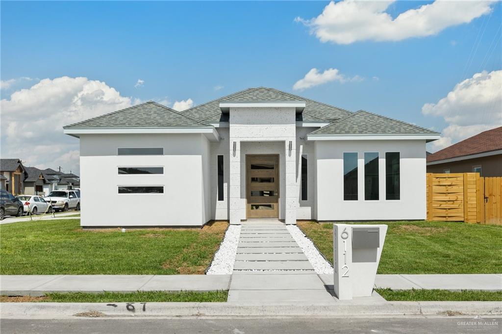 Prairie-style house with a front lawn