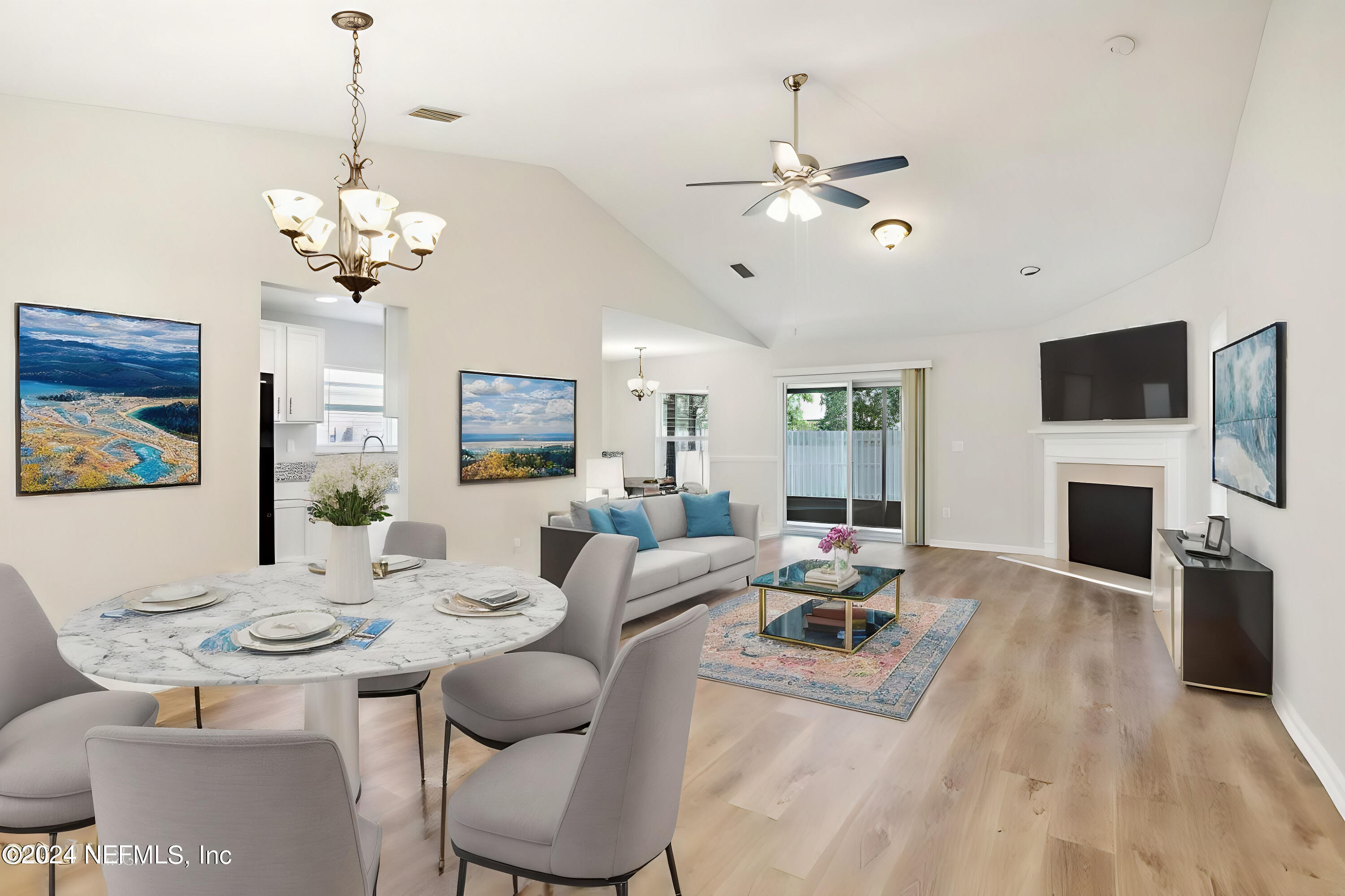 a living room with fireplace furniture and a flat screen tv