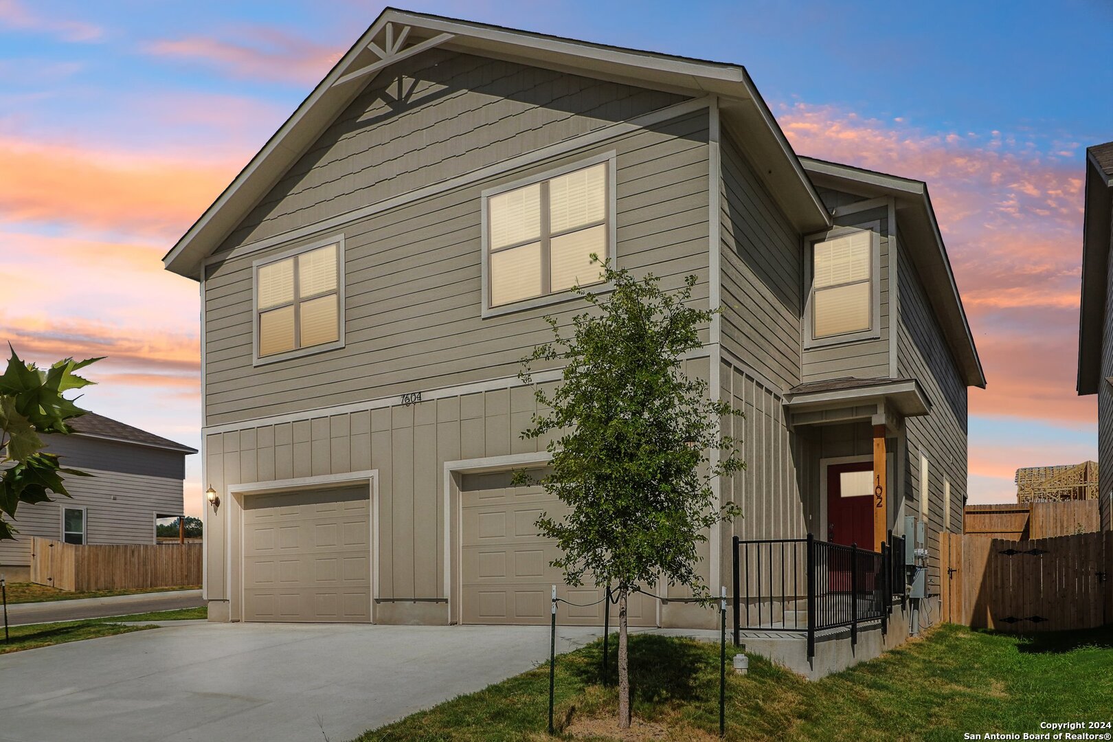 a front view of a house with a yard