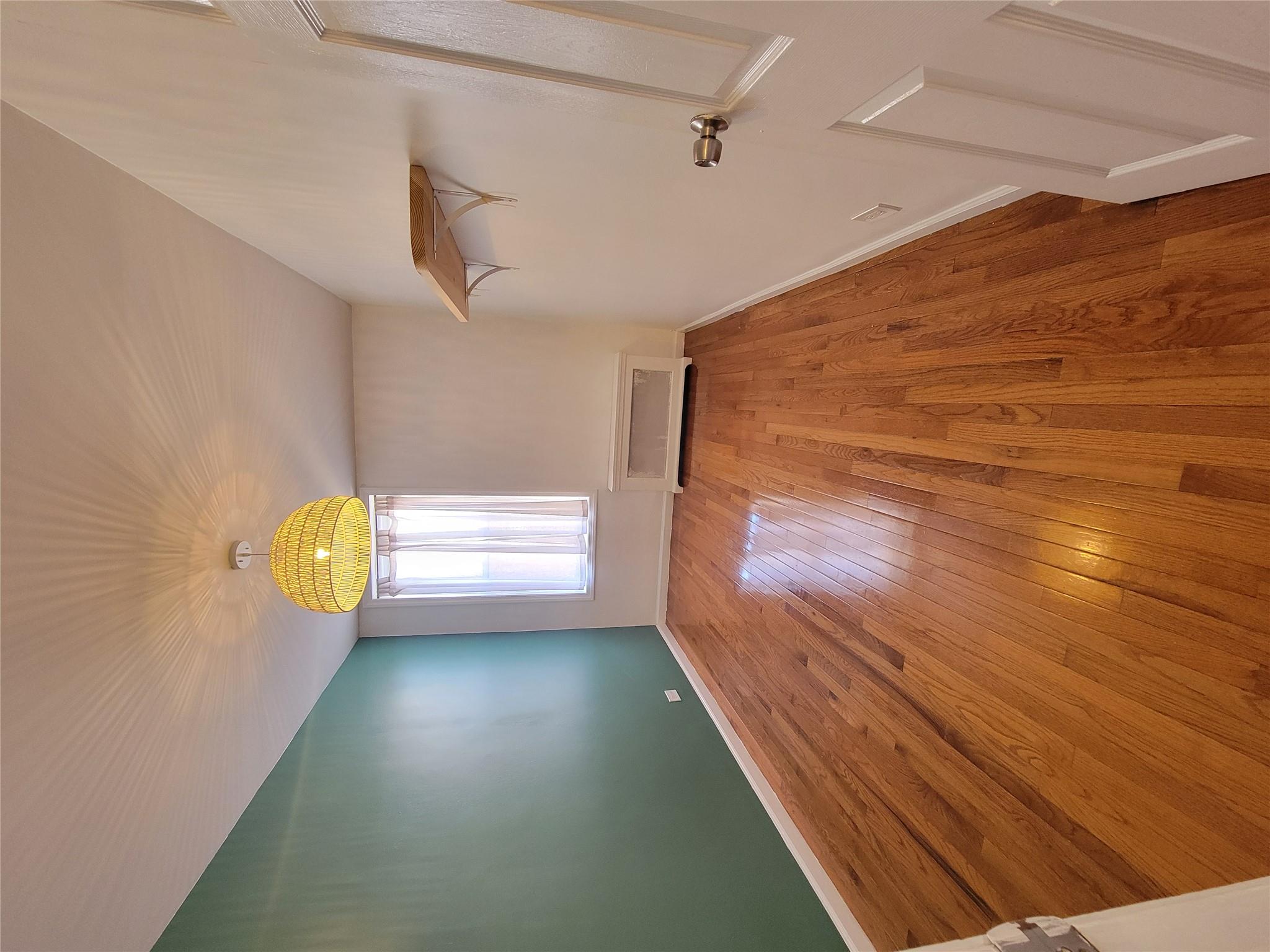 Spare room featuring light wood-type flooring