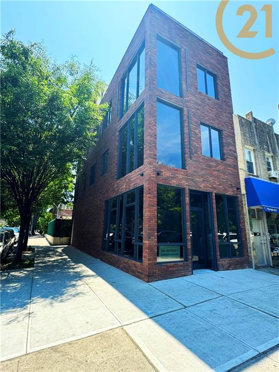 a view of a brick building with many windows