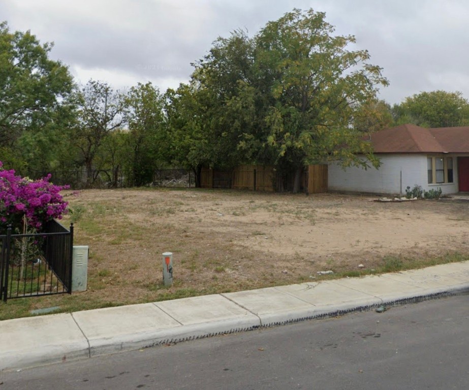 a brick house with a yard