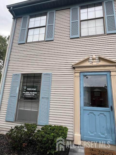 a view of a house with door and a garage