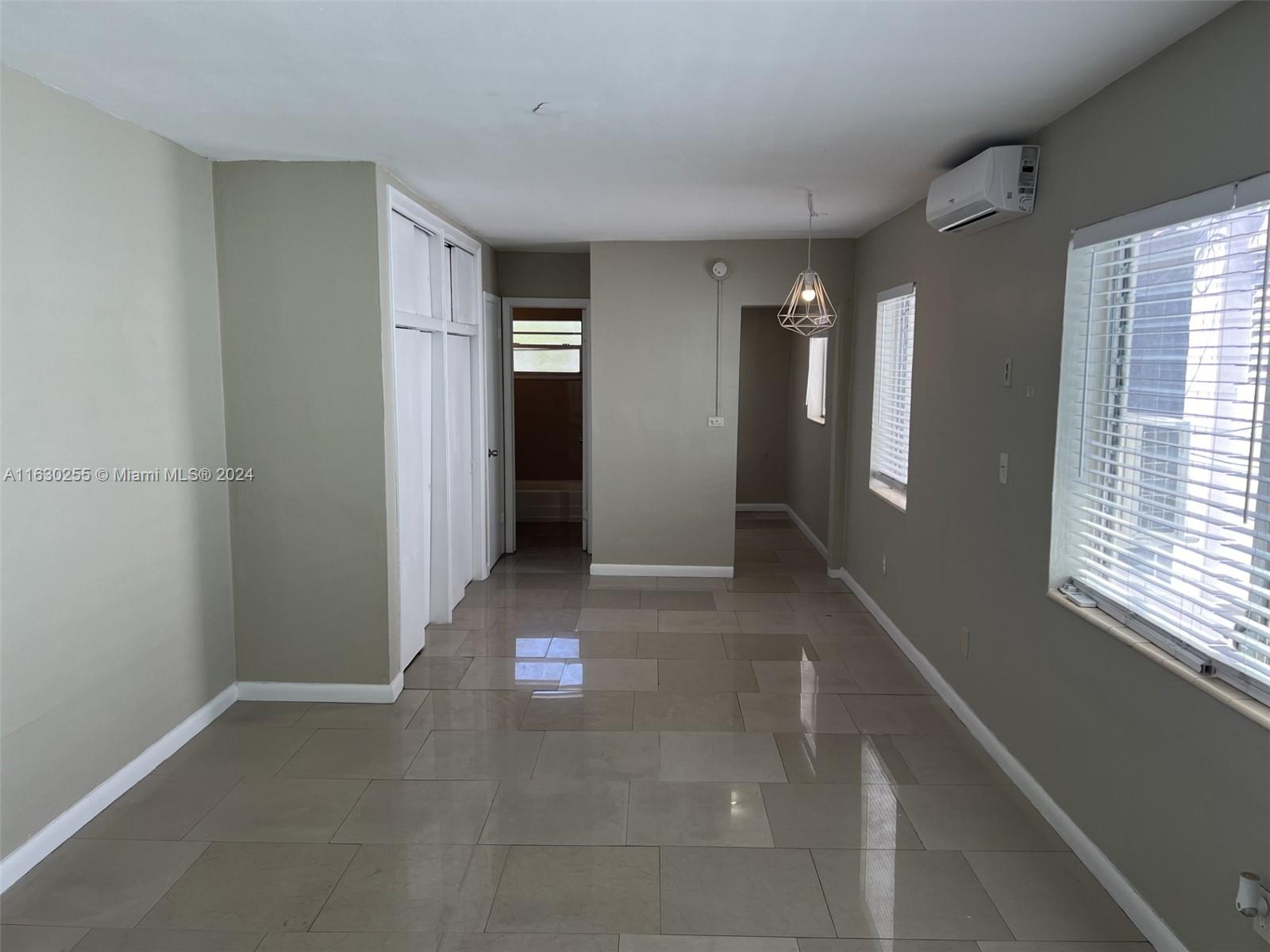 a view of hallway with windows