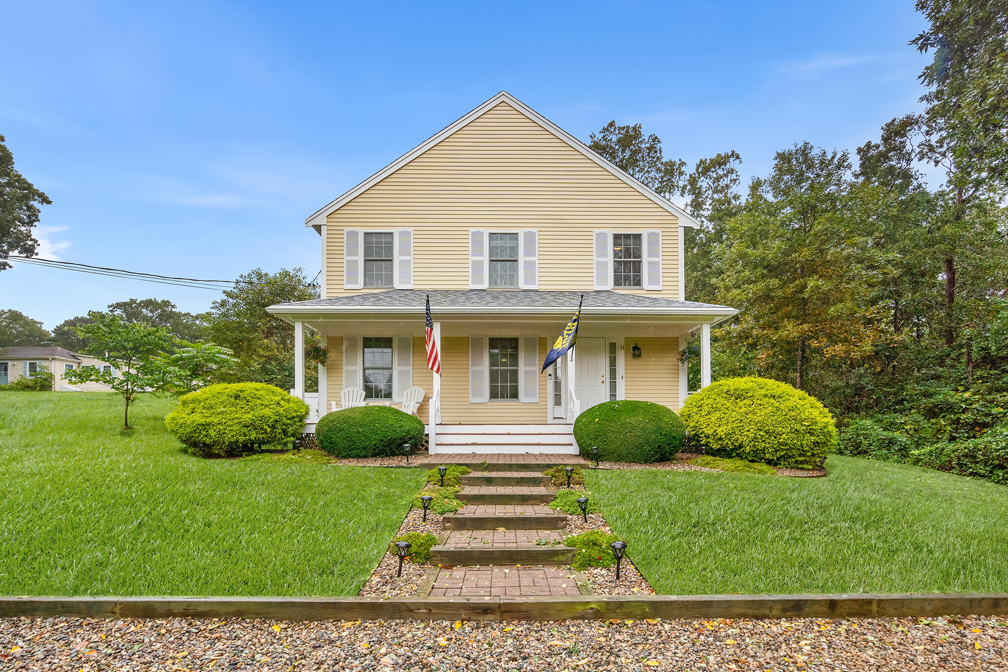 a front view of a house and garden