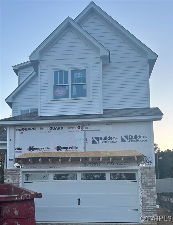 View of front facade with a garage