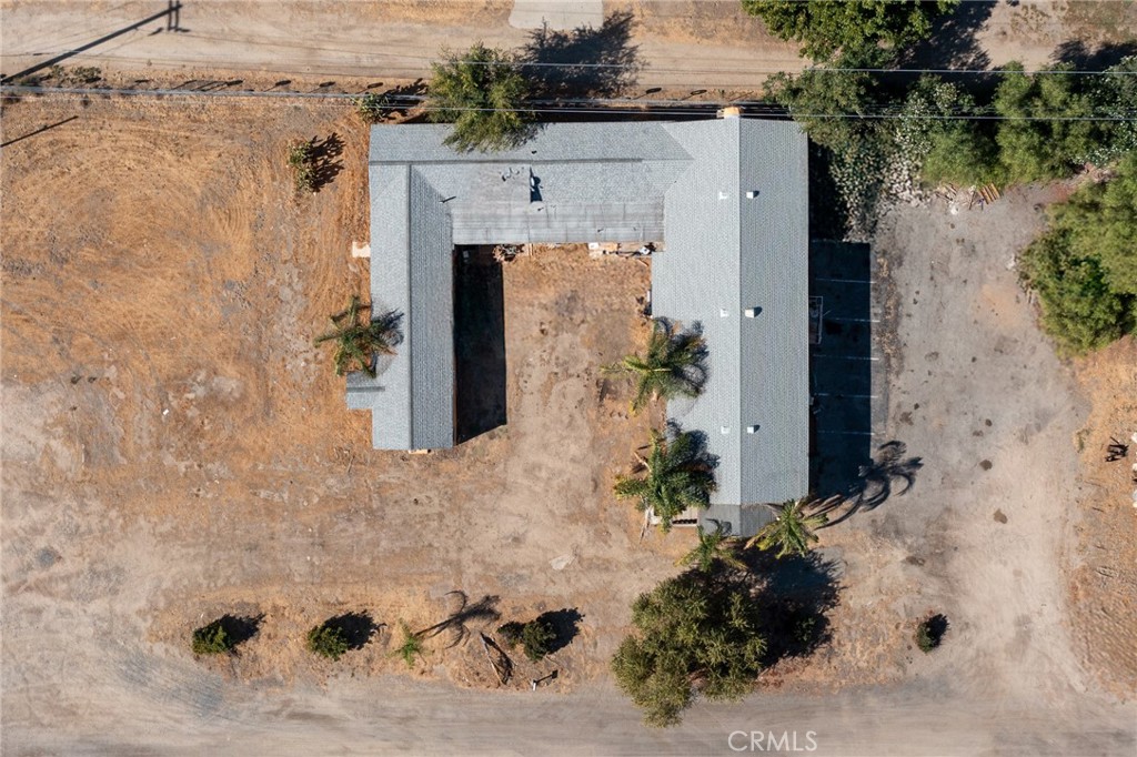 an aerial view of a house with a yard