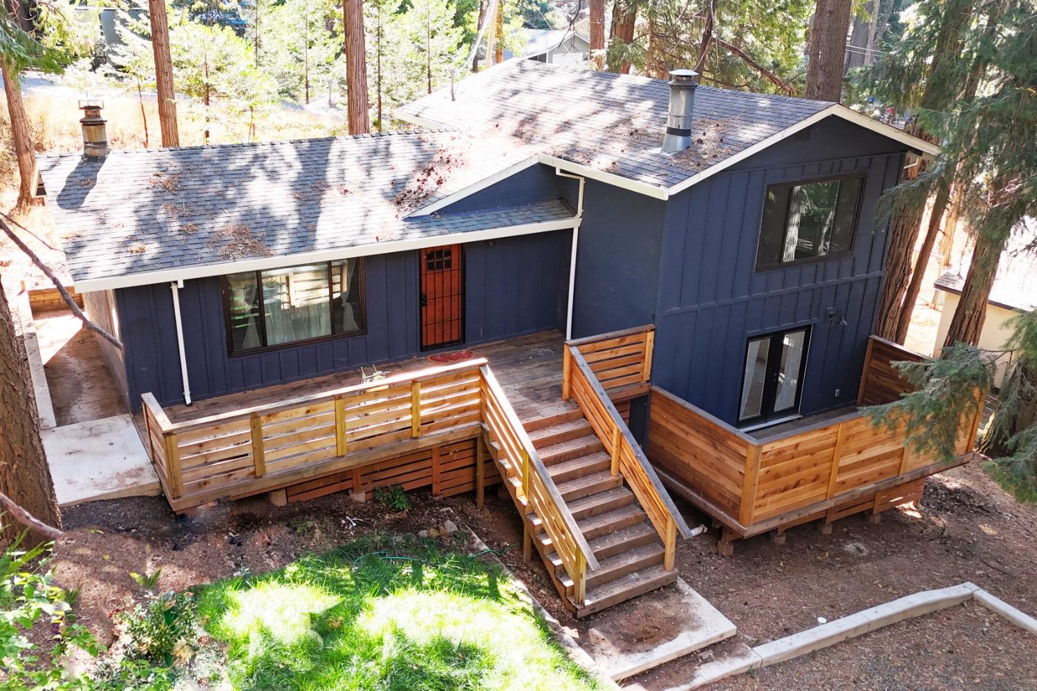 a front view of a house with wooden fence