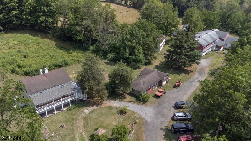 an aerial view of house with yard swimming pool and outdoor seating