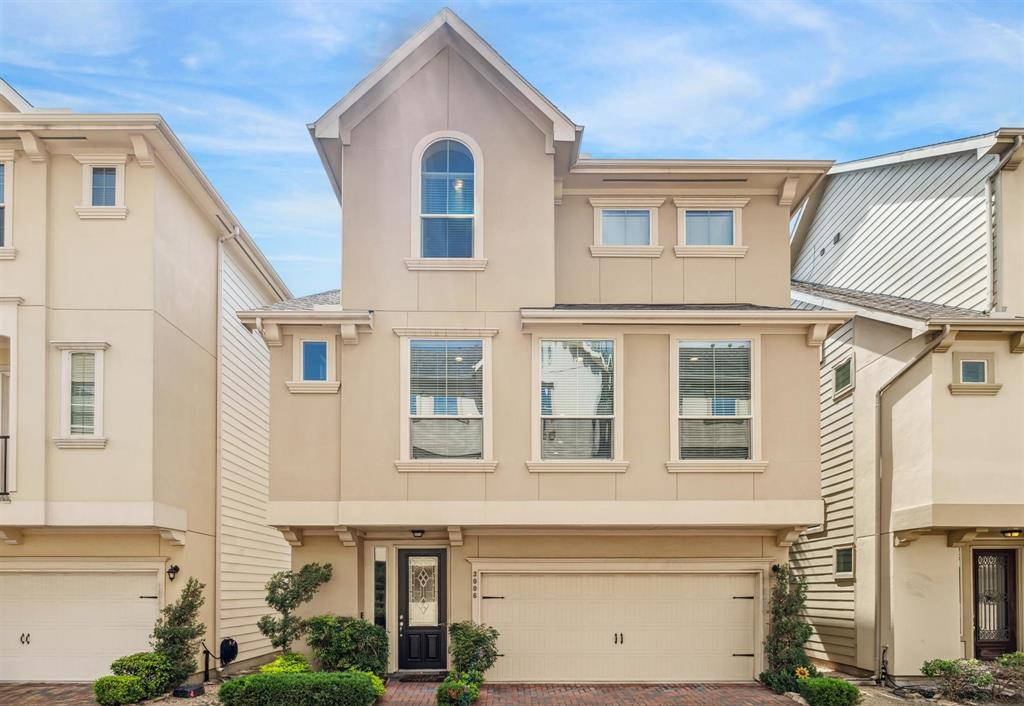 a front view of a house with a lot of windows