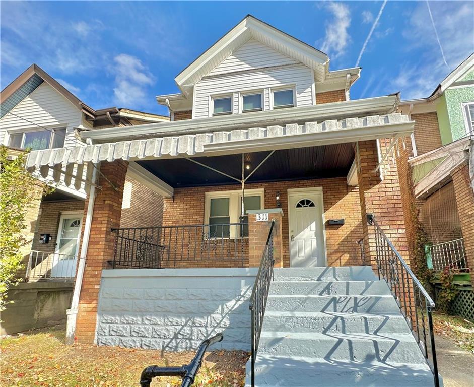 a front view of a house with a balcony