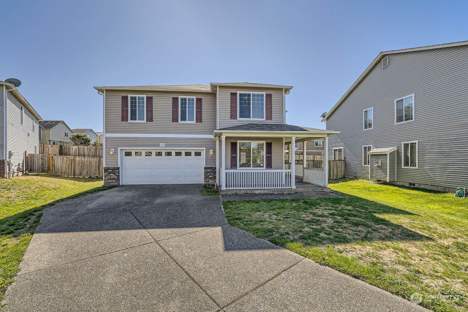 a view of a house with backyard porch and sitting area