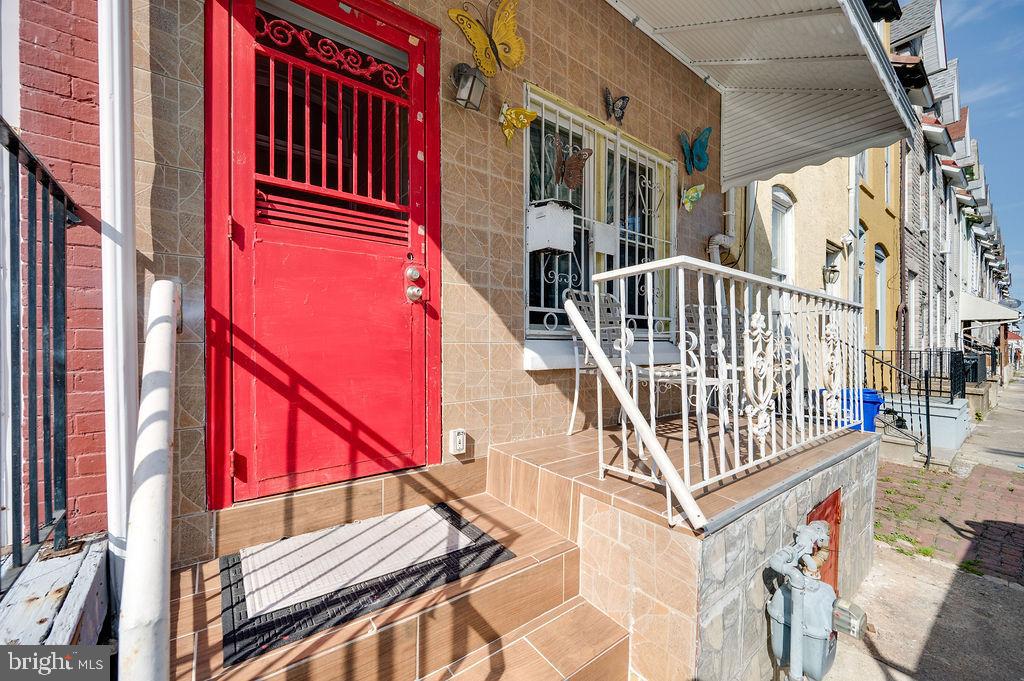 a view of balcony with wooden floor and fence