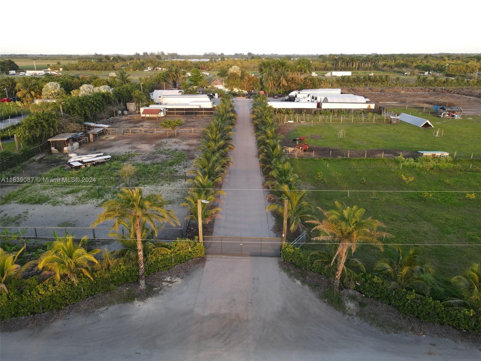 an aerial view of residential building with outdoor space and lake view