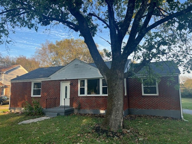 front view of a house with a yard