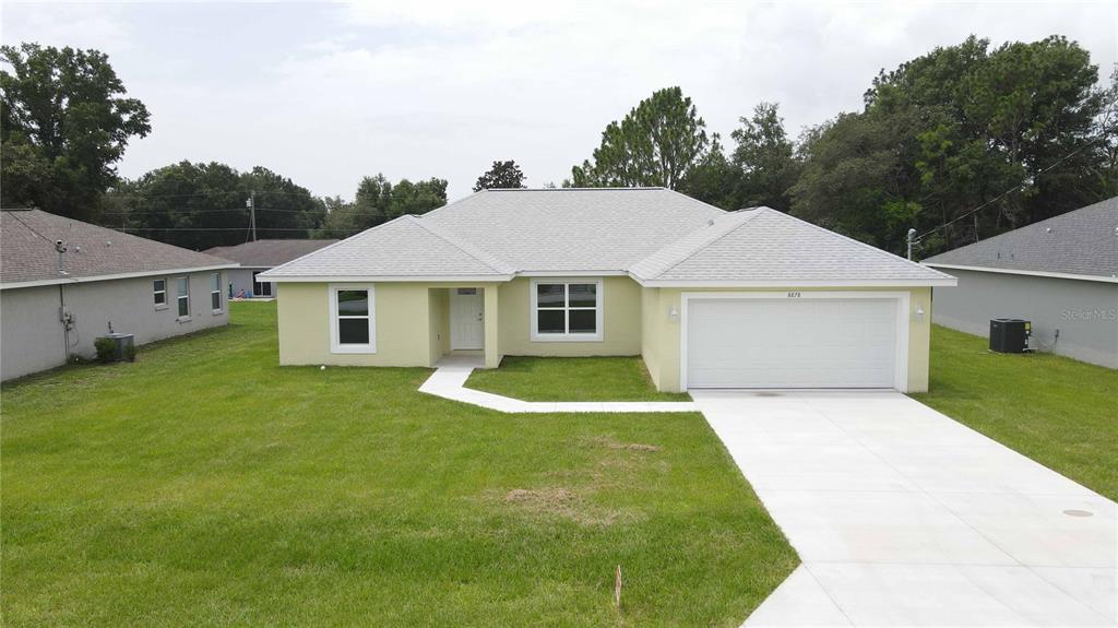 a front view of a house with a yard