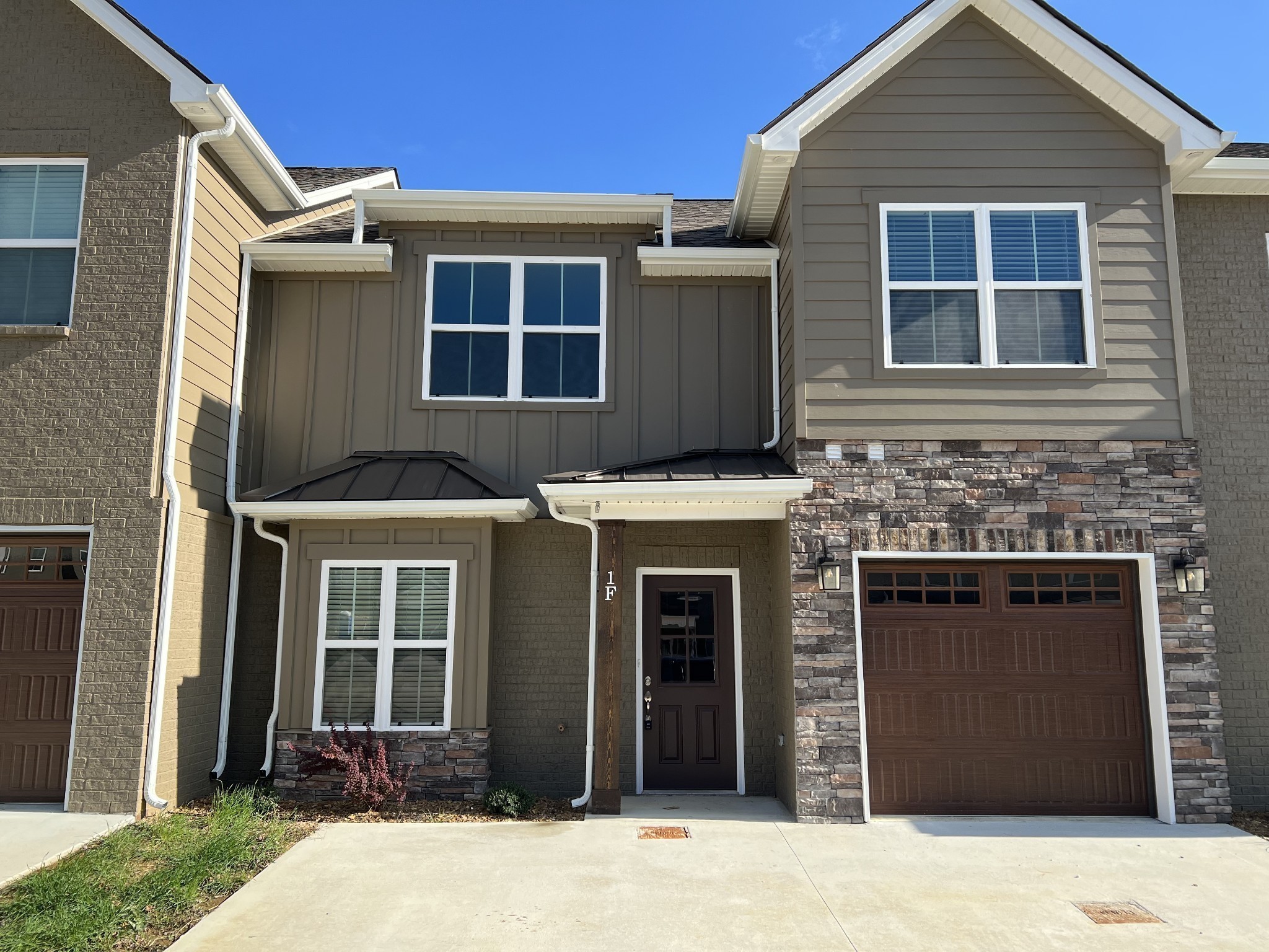 a front view of a house with yard