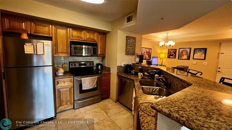 a kitchen with a stove and a sink