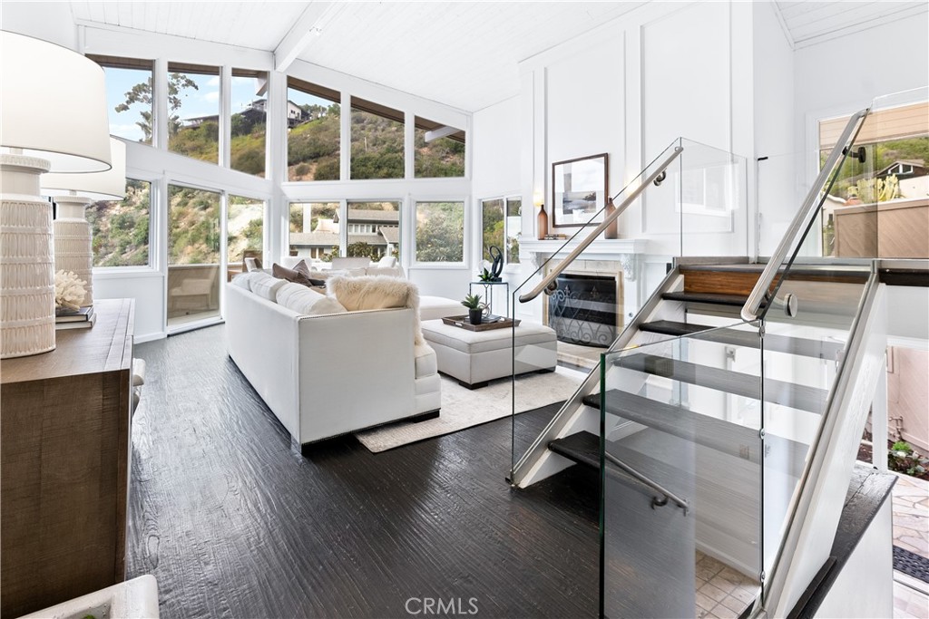 a living room with furniture window and wooden floor